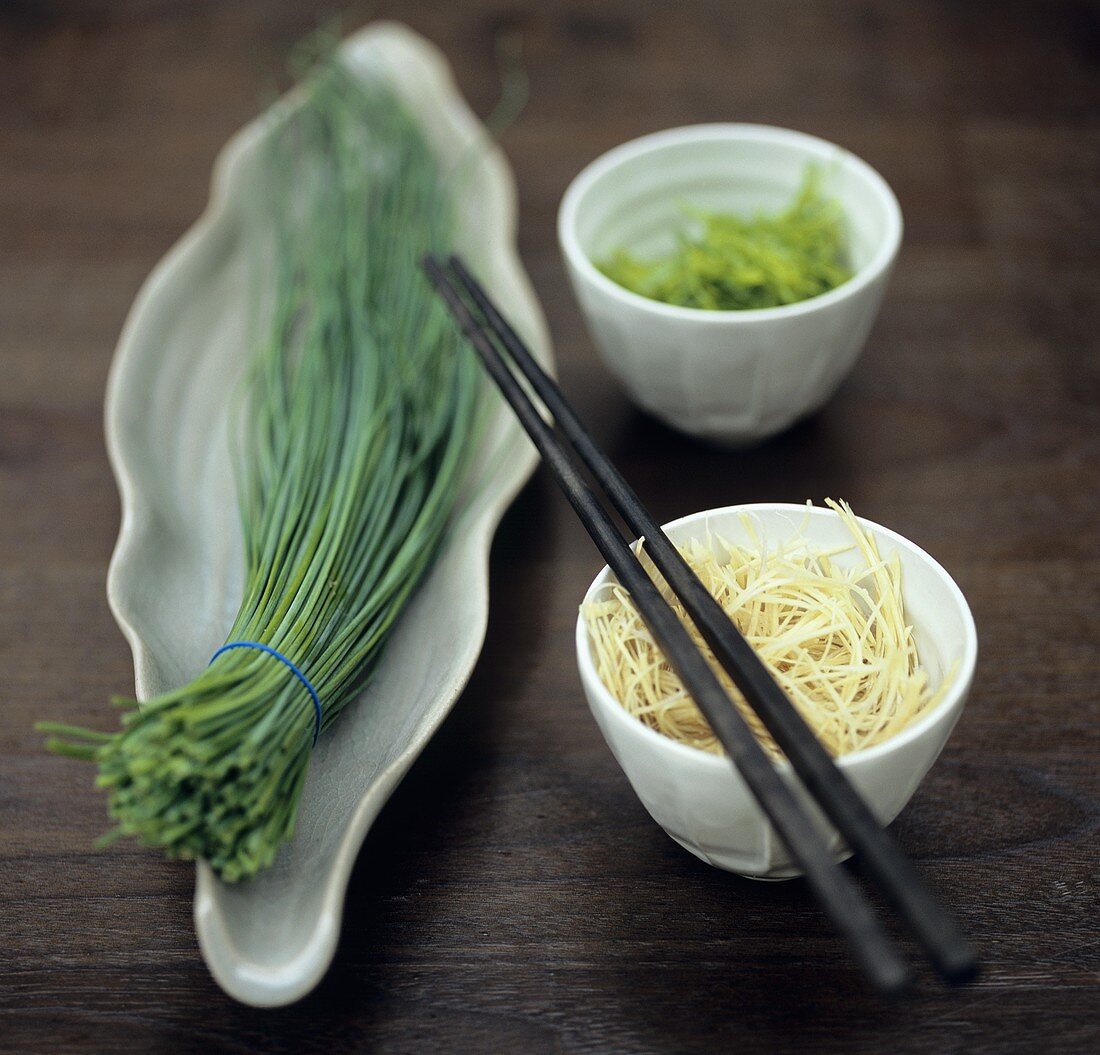 Chives, spring onions, noodles and chopsticks