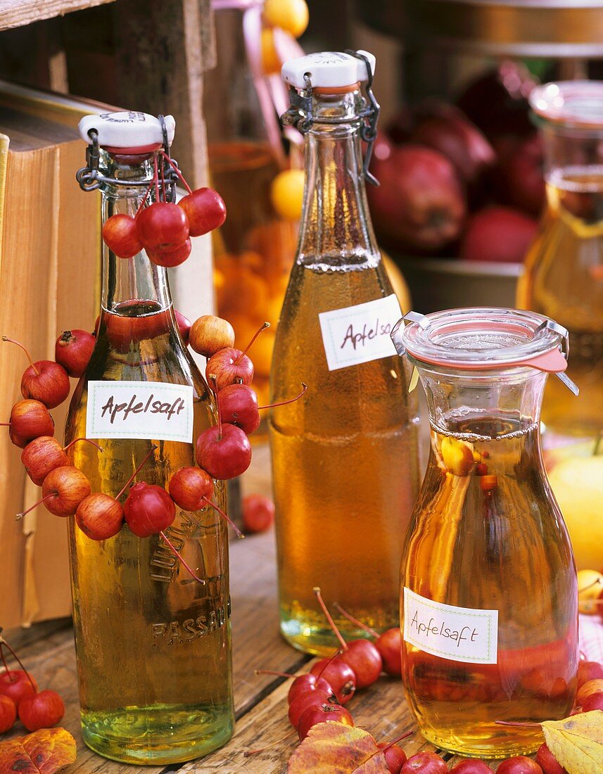 Home-made clear apple juice in bottles