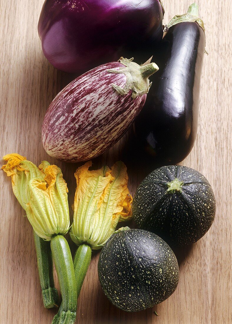 Various types of aubergines and courgettes