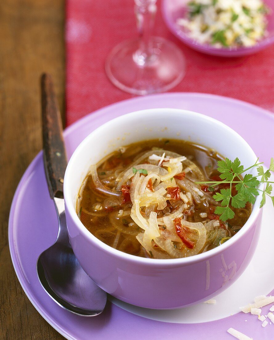 Onion soup with capers and dried tomatoes