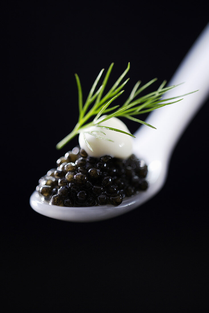 Black caviar on a mother-of-pearl spoon