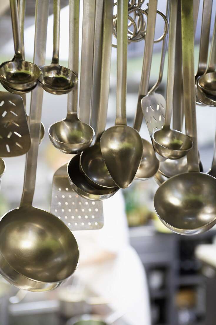 Various ladles in a commercial kitchen