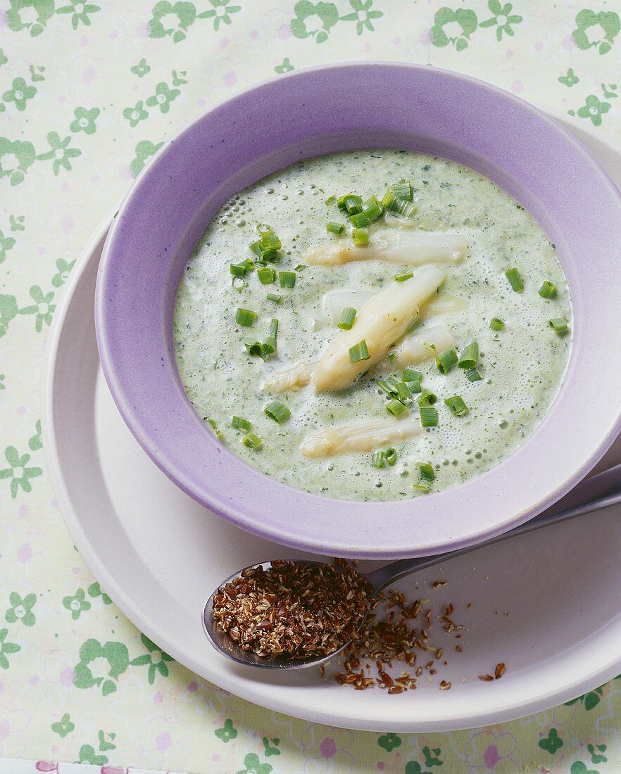 Spring herb soup with asparagus and linseed