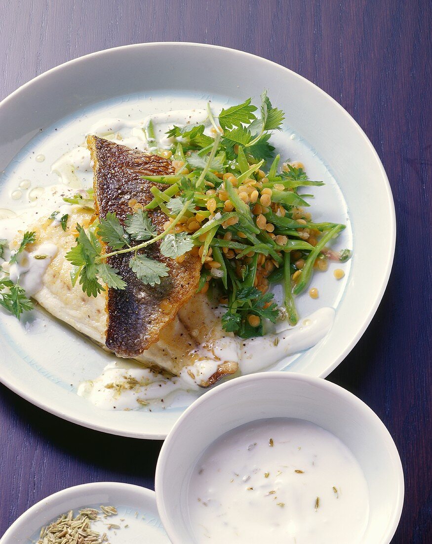 Sea bream with mangetout, red lentils and yoghurt sauce