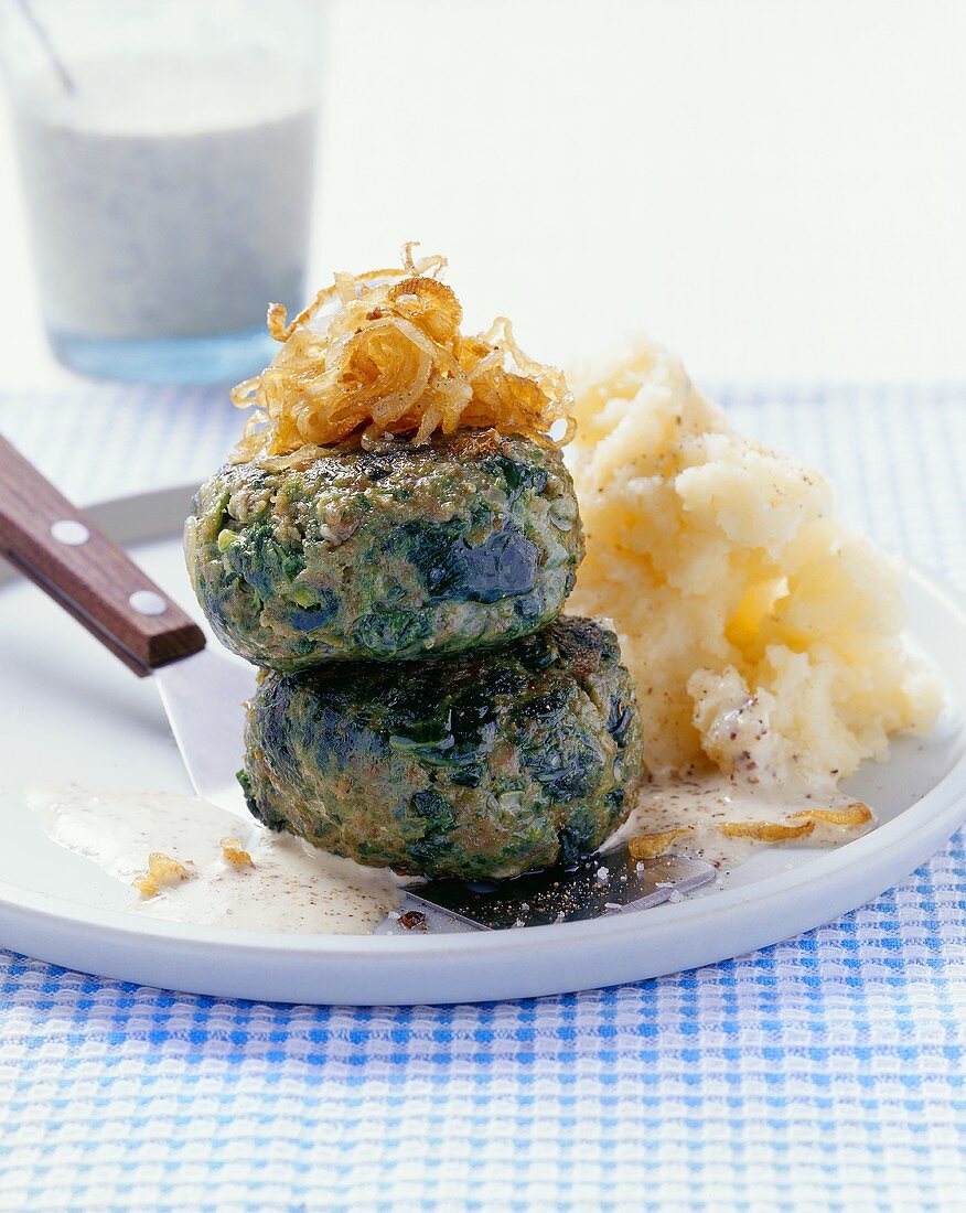 Kale burgers with fried onions and coarse mustard sauce