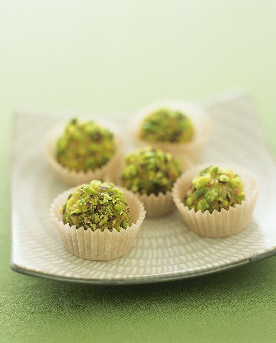Marzipan sweets coated in chopped pistachios