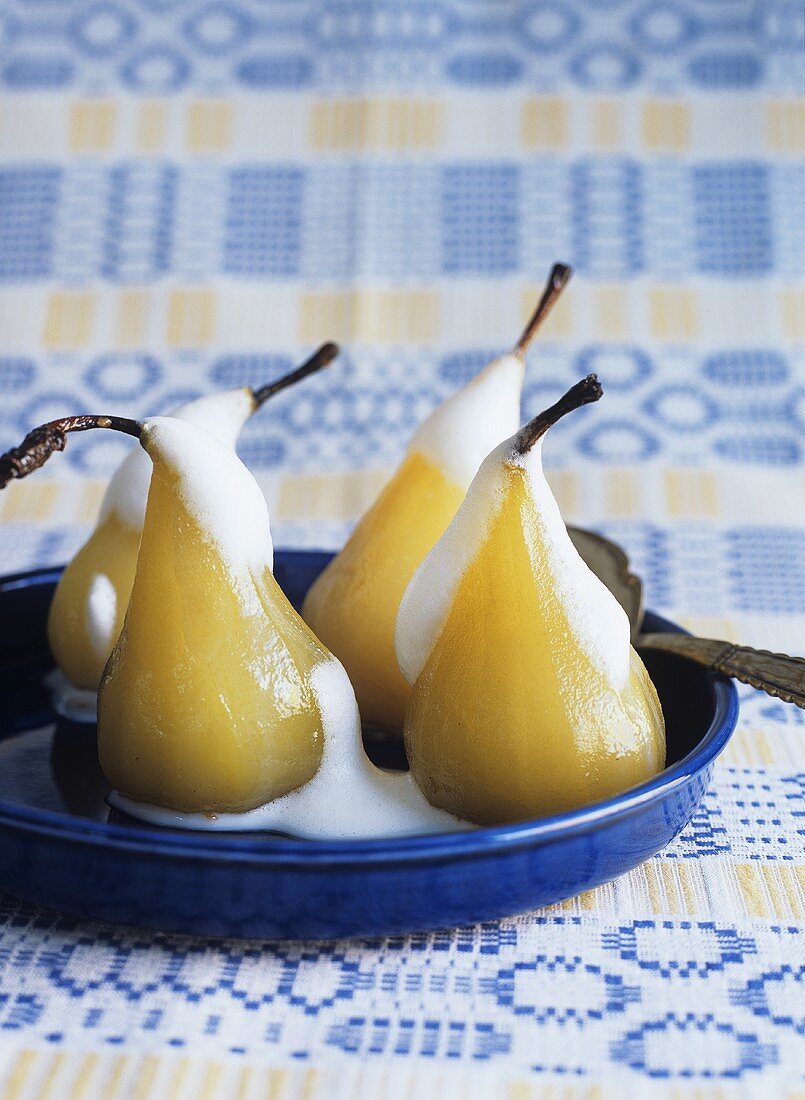 Poached pears with almond stuffing and Amaretto milk foam