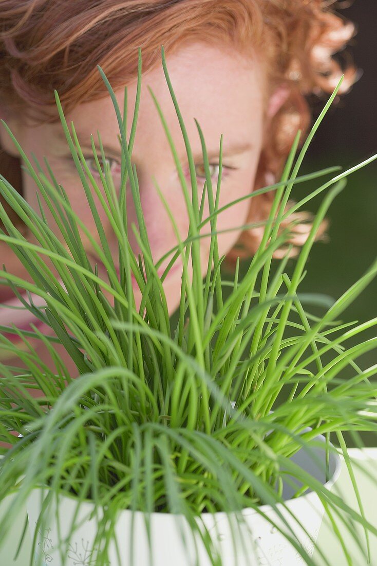 Young woman behind chives
