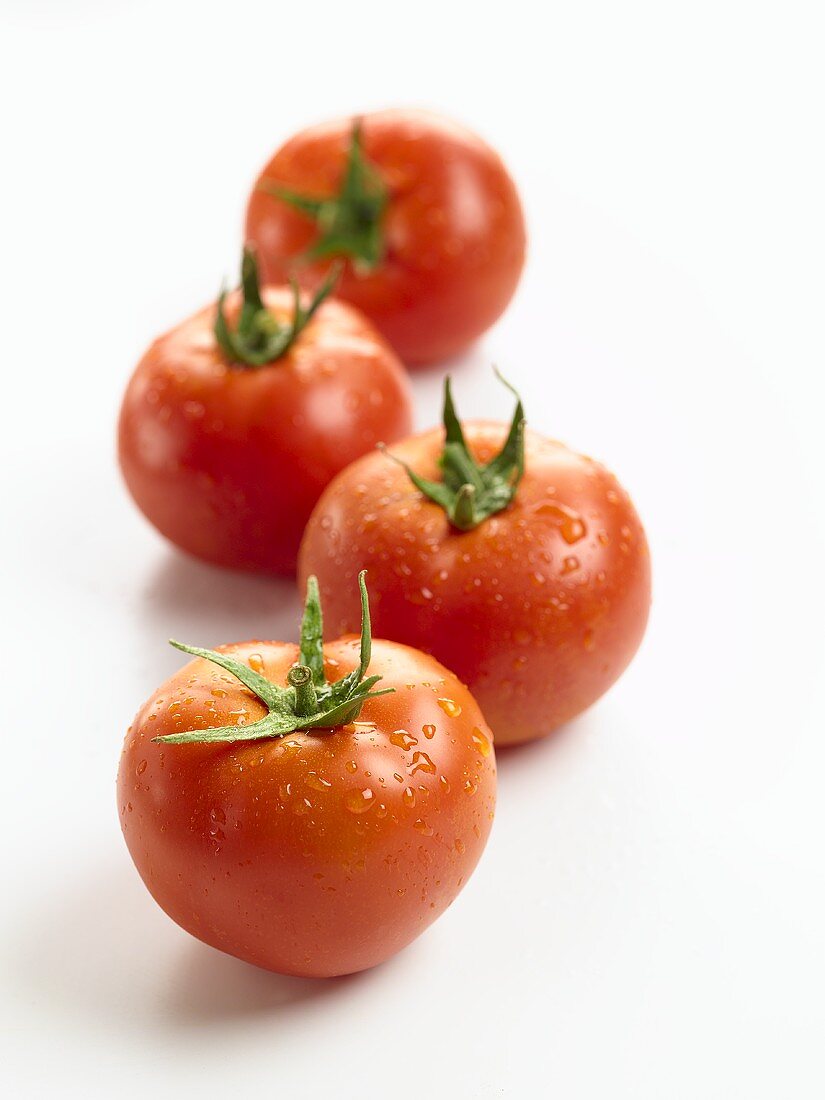 Four fresh tomatoes