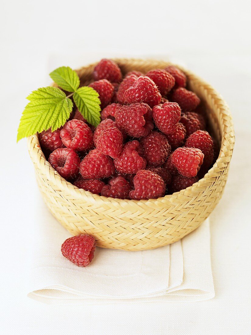 Raspberries in a small basket