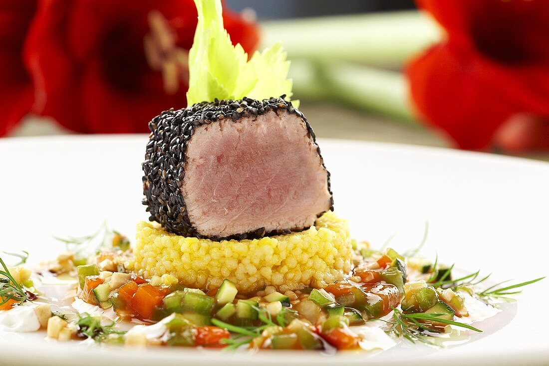 Tuna in sesame crust on couscous and ratatouille