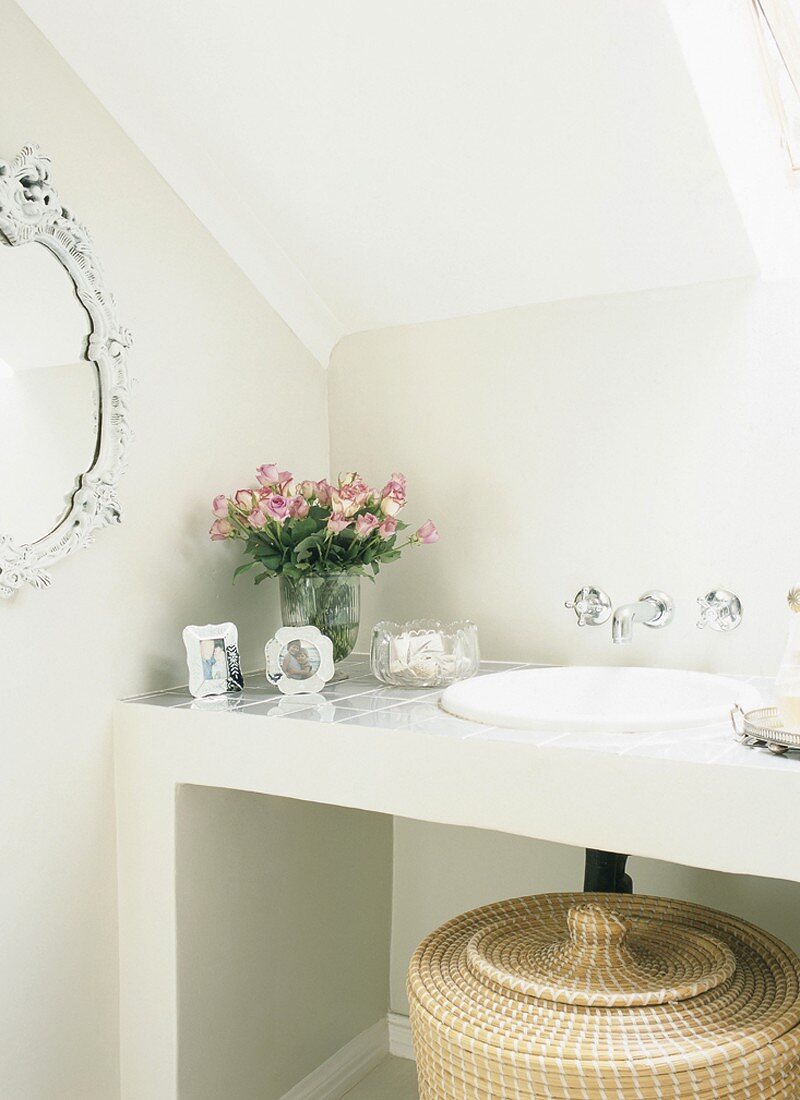 Wash basin with flowers beside it