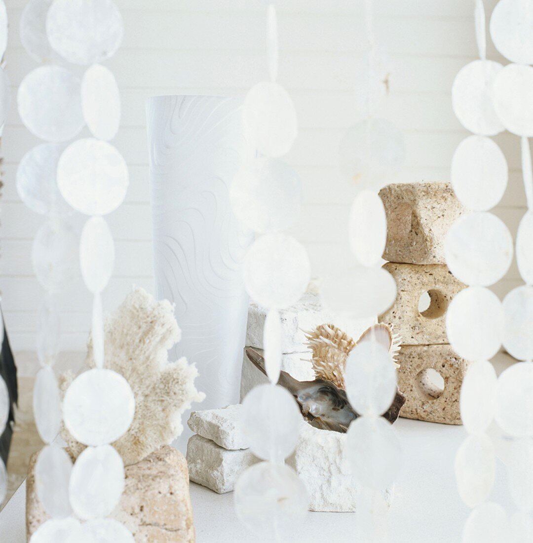 Stacked stones behind a paillette curtain