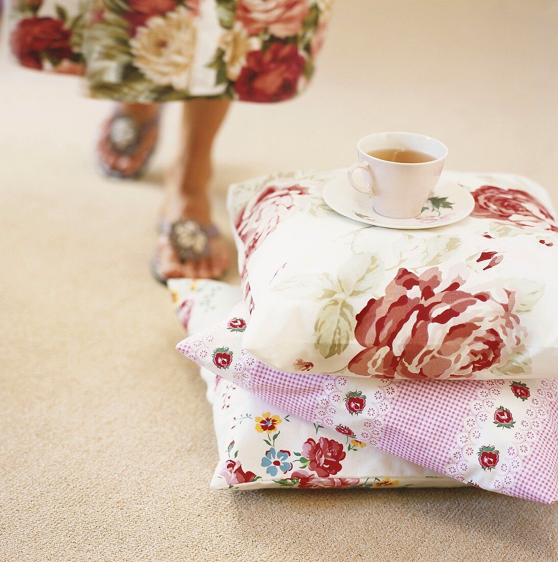 Teacup on stack of cushions