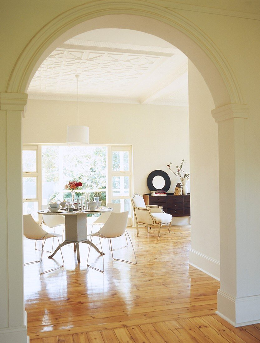 View of dining room through arched doorway