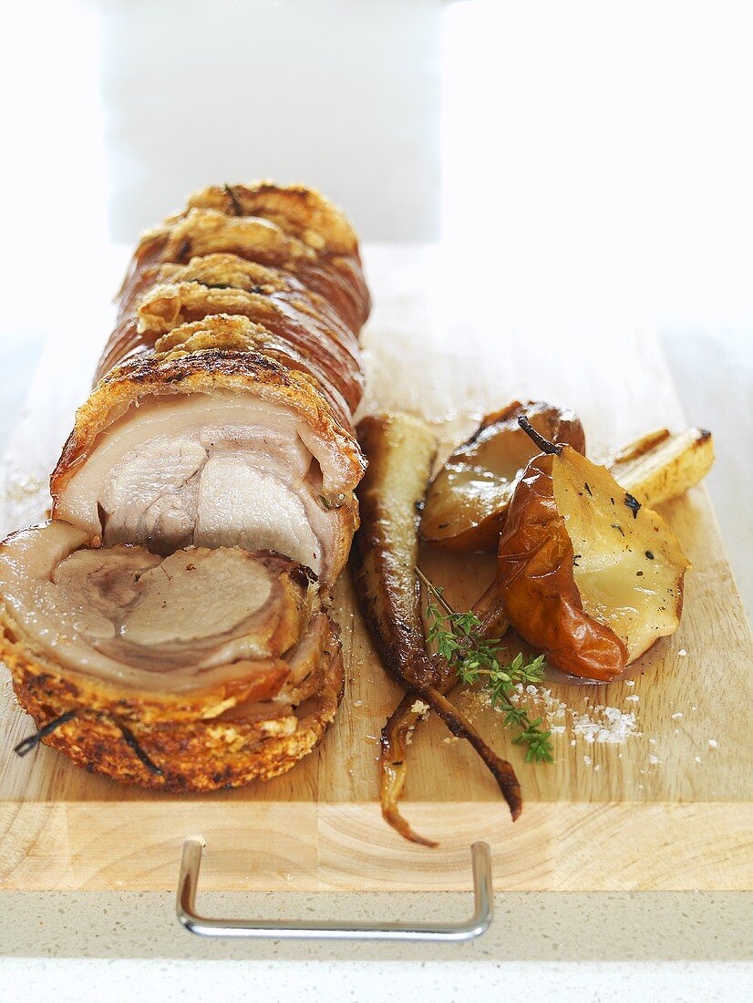 Rolled pork roast with baked pears and parsnips