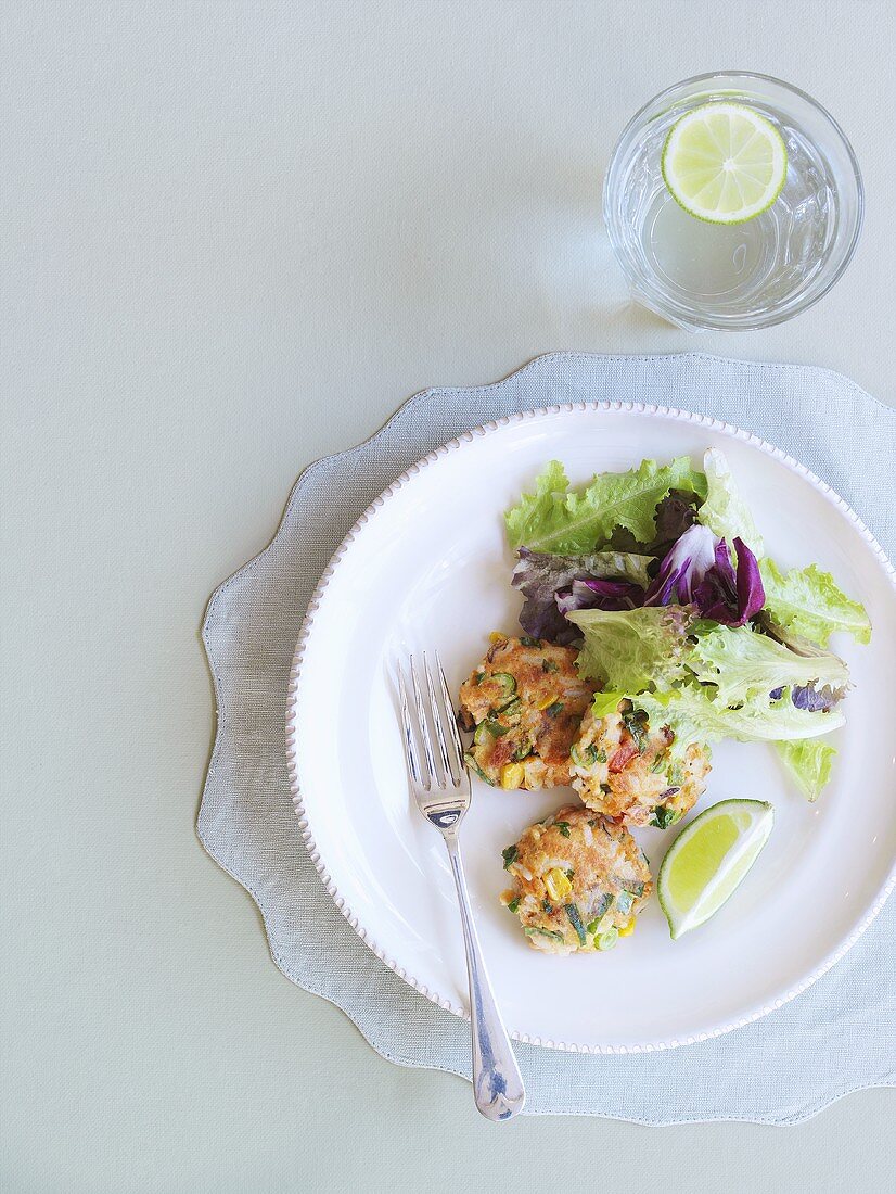 Small salmon cakes with coriander and salad