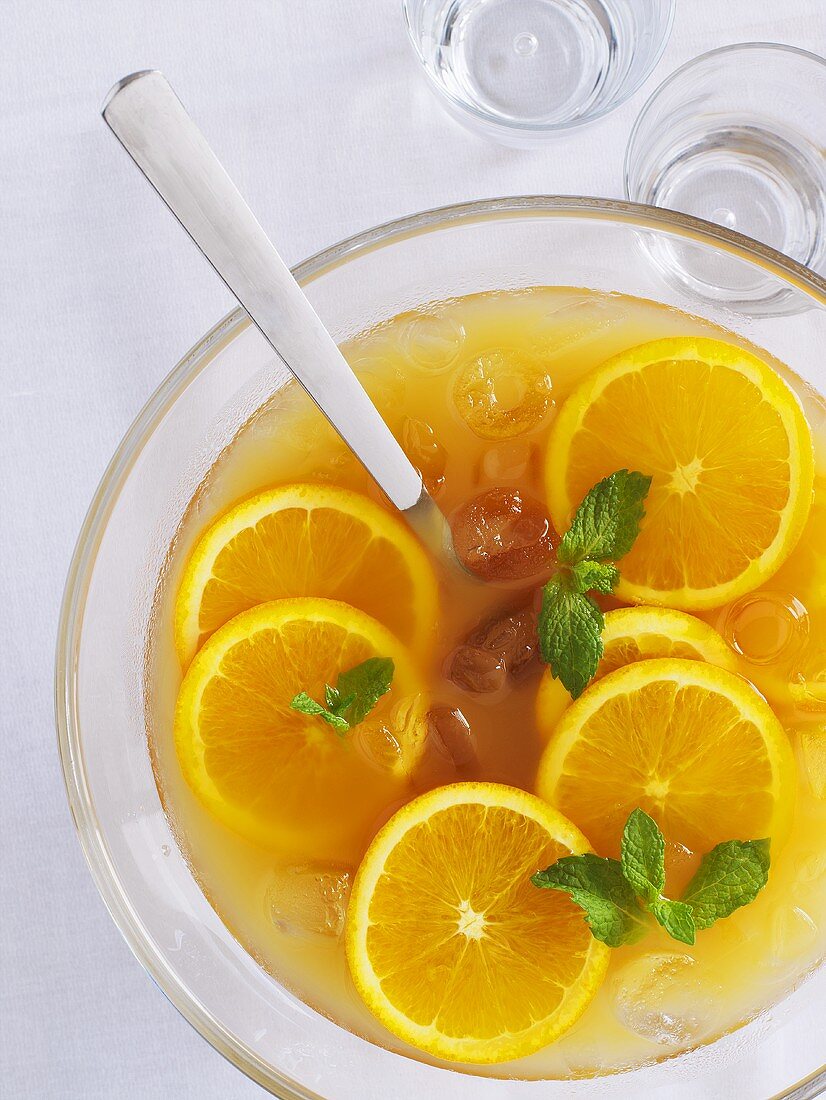 Orange punch with mint and ice cubes