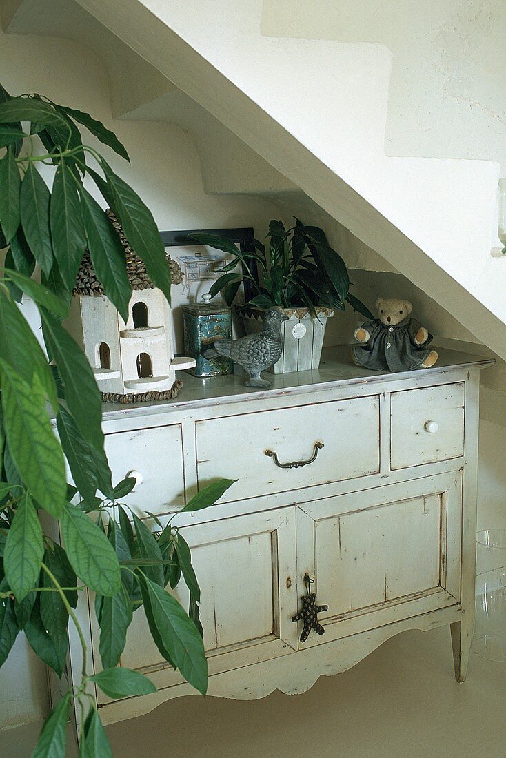 A chest of drawers in the stairs