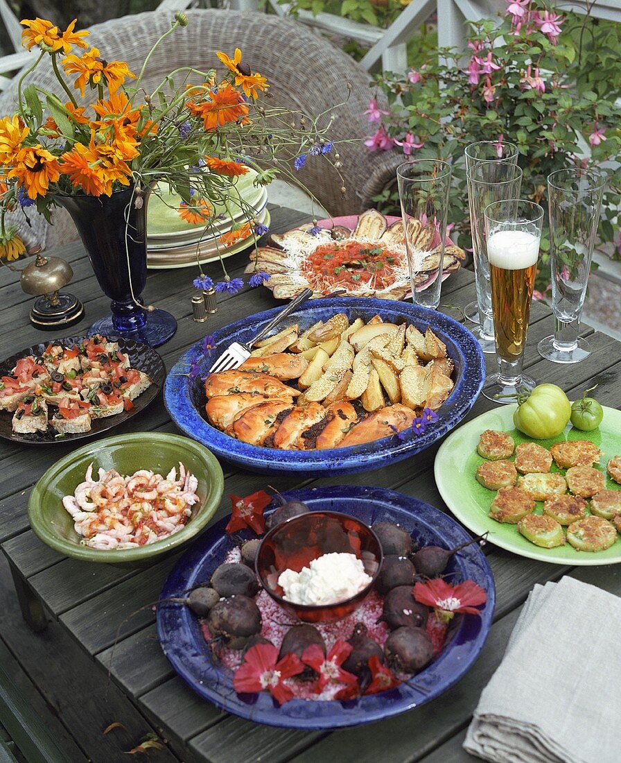 An assortment of dishes on a table out of doors