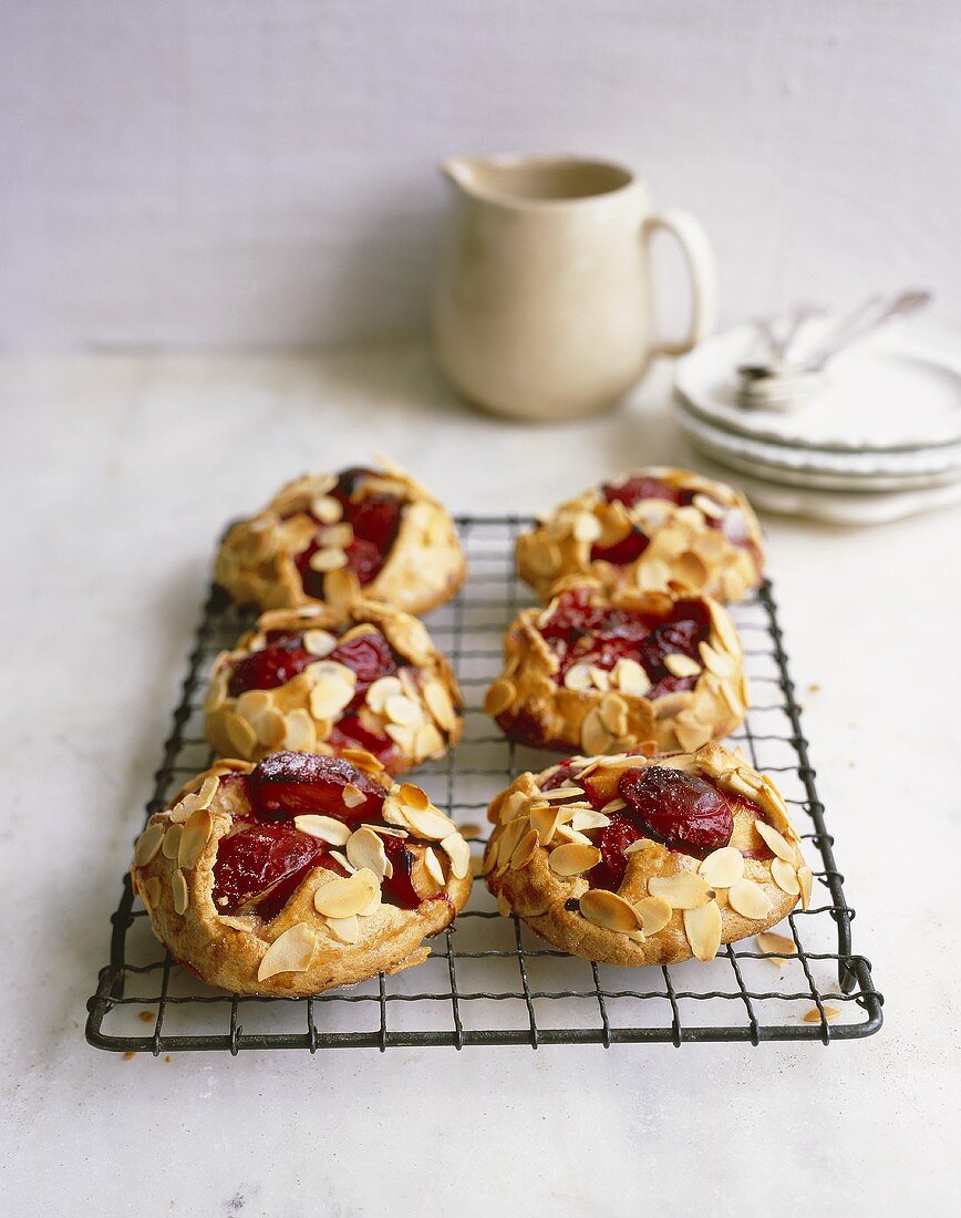 Plum pies with flaked almonds