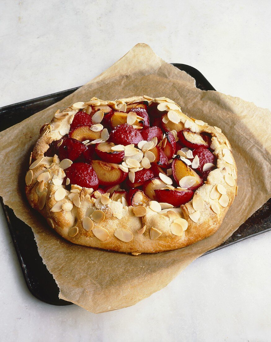 Plum pie with flaked almonds