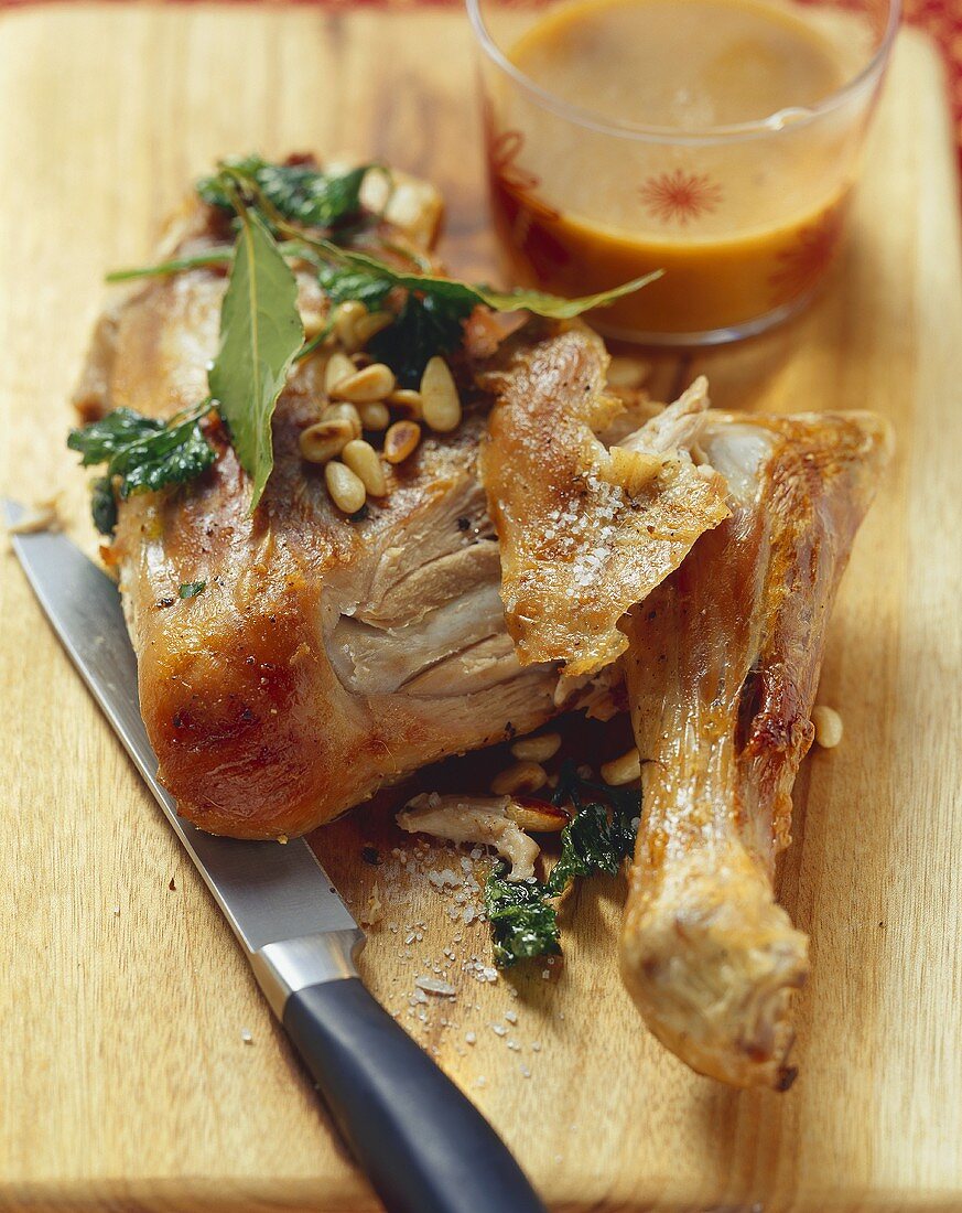 Chicken leg with pine nuts and herbs