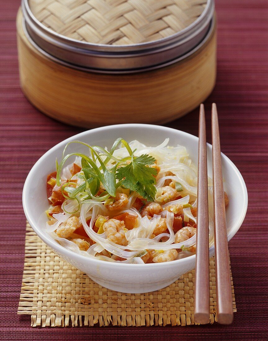 Glass noodles and shrimps steamed in a bamboo basket