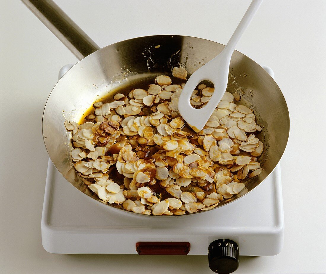 Making almond brittle in a frying pan