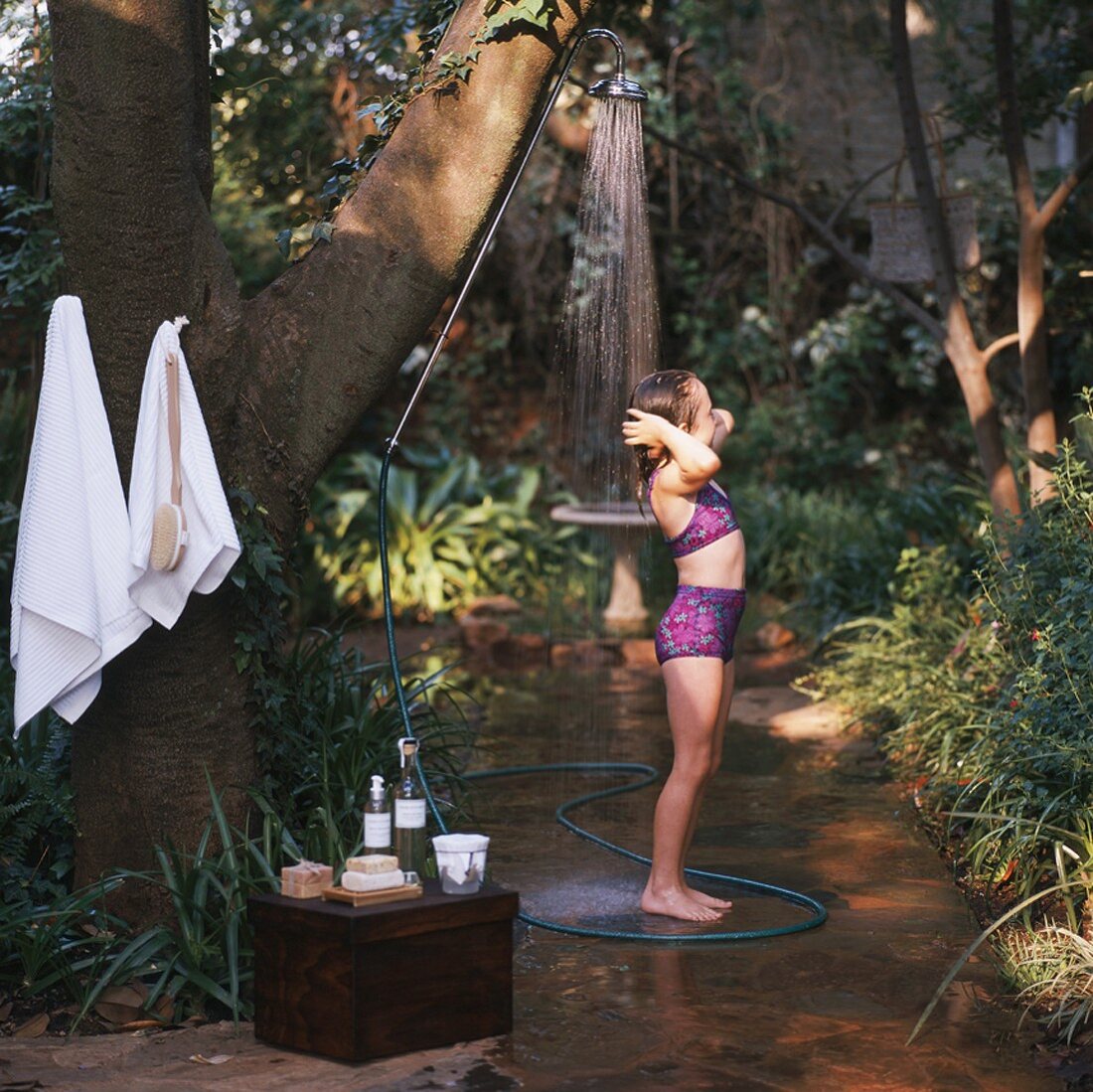 Girl showering in garden