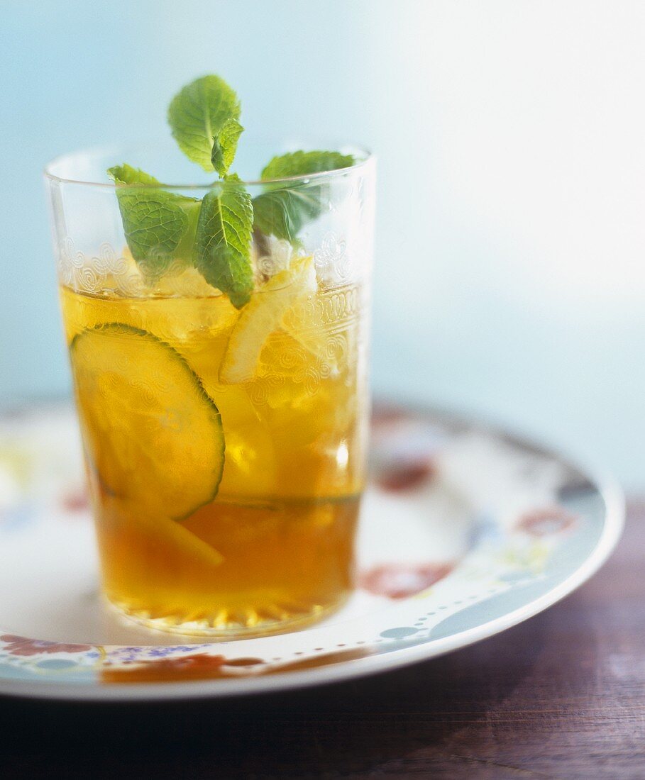 Pimms cocktail with cucumber slices and mint