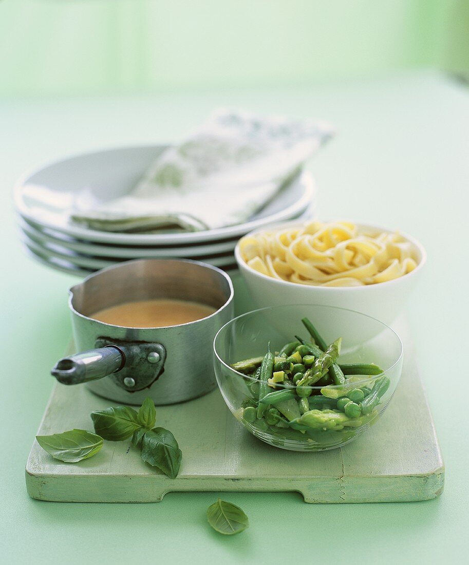 Ingredients for ribbon pasta with green vegetables