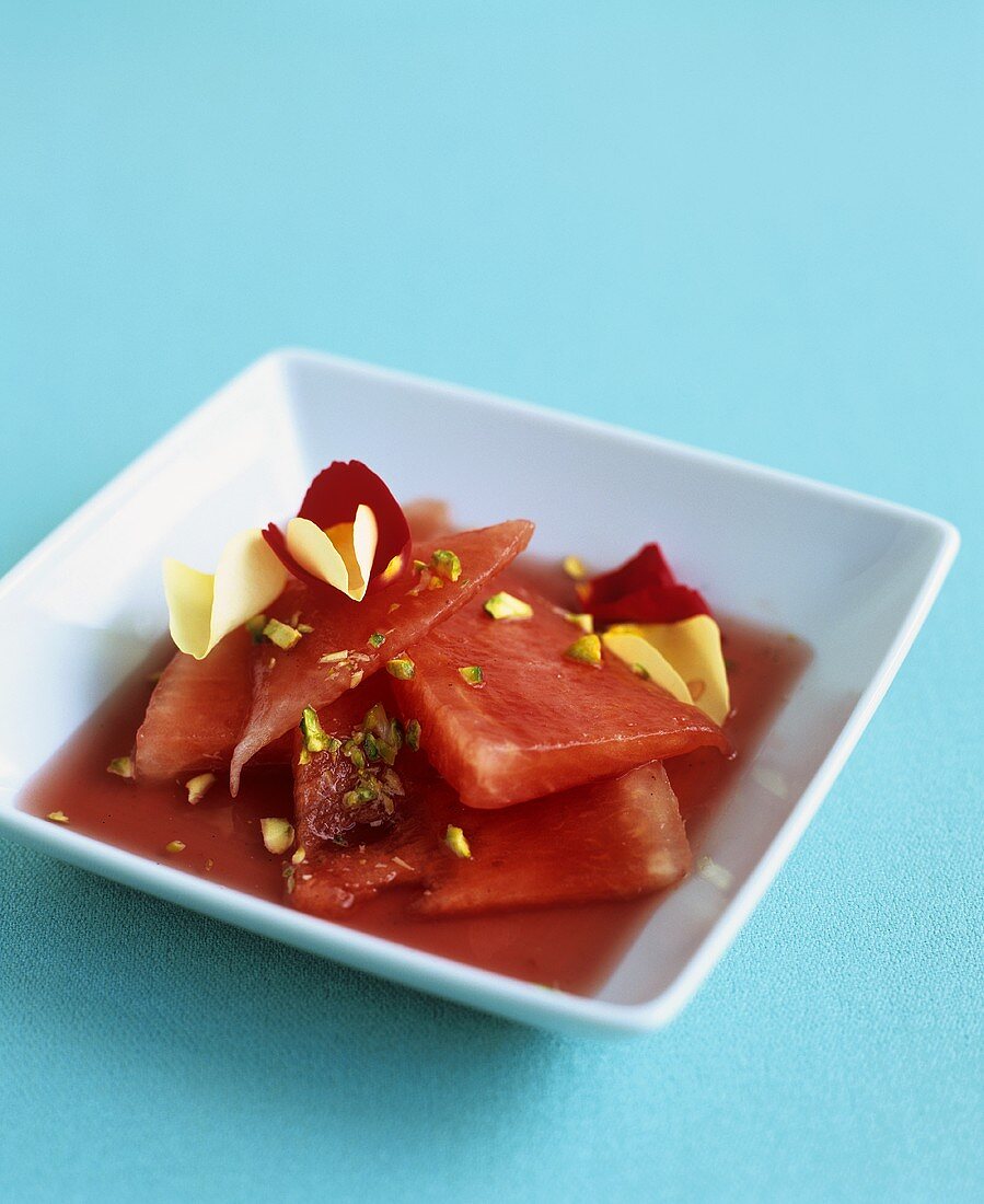 Watermelon in rosé wine with pistachios