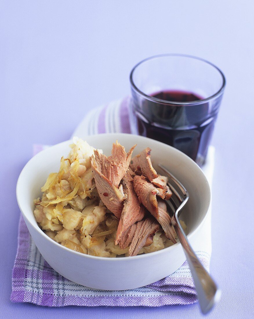 Lamb on boulangère potatoes with red wine