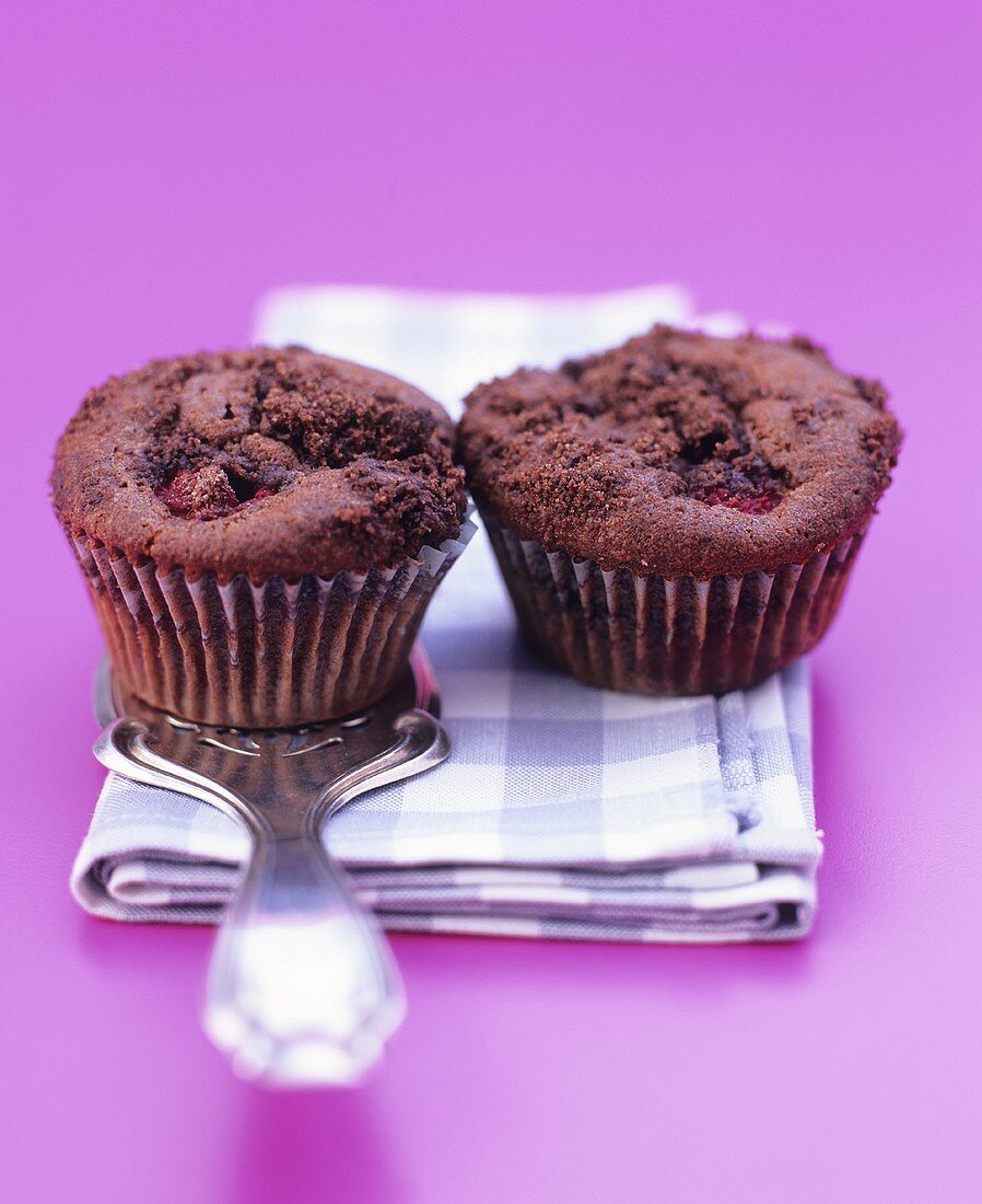 Two chocolate raspberry muffins