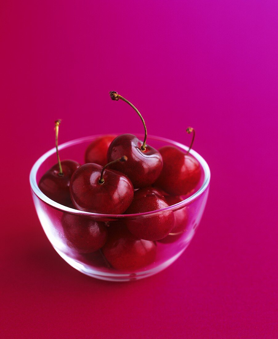 Cherries in a small glass dish