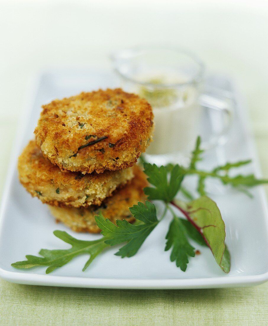 Three small fish cakes with dip