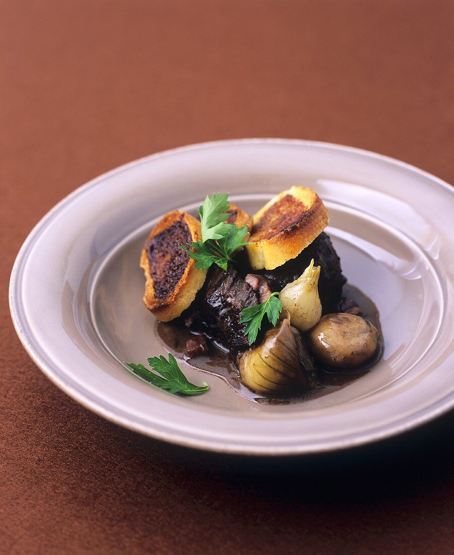 Beef in red wine with Marmite crostini