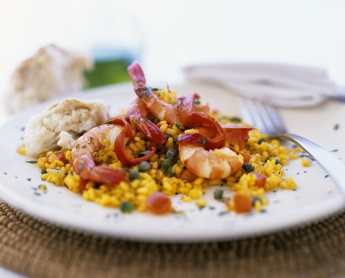 Saffron rice with prawns, peppers and capers
