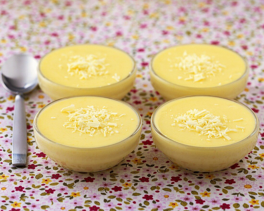 Four small bowls of white chocolate mousse