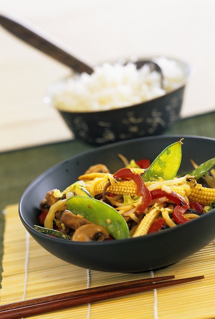 Vegetable stir-fry with mangetout, baby corn and soya bean sprouts