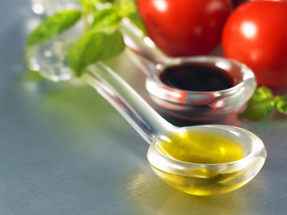 A spoonful of olive oil and a spoonful of balsamic vinegar
