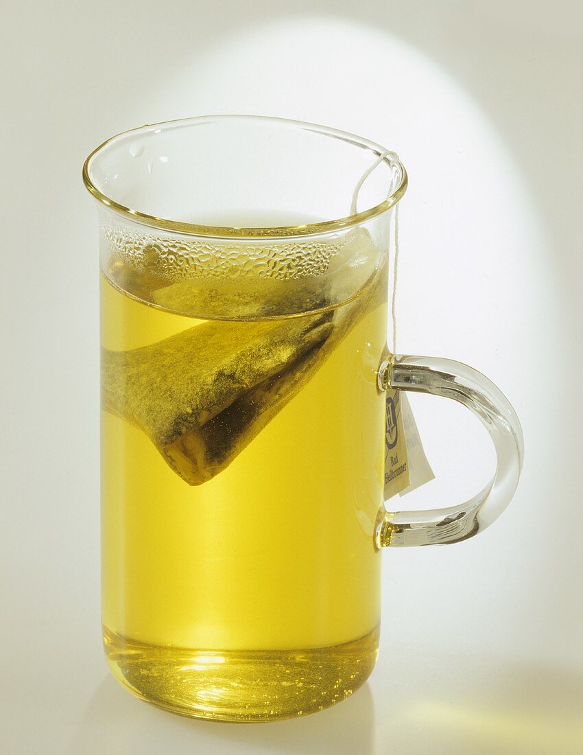 Tea with tea bag in a glass cup