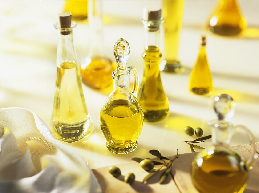 Various plant oils in bottles and carafes