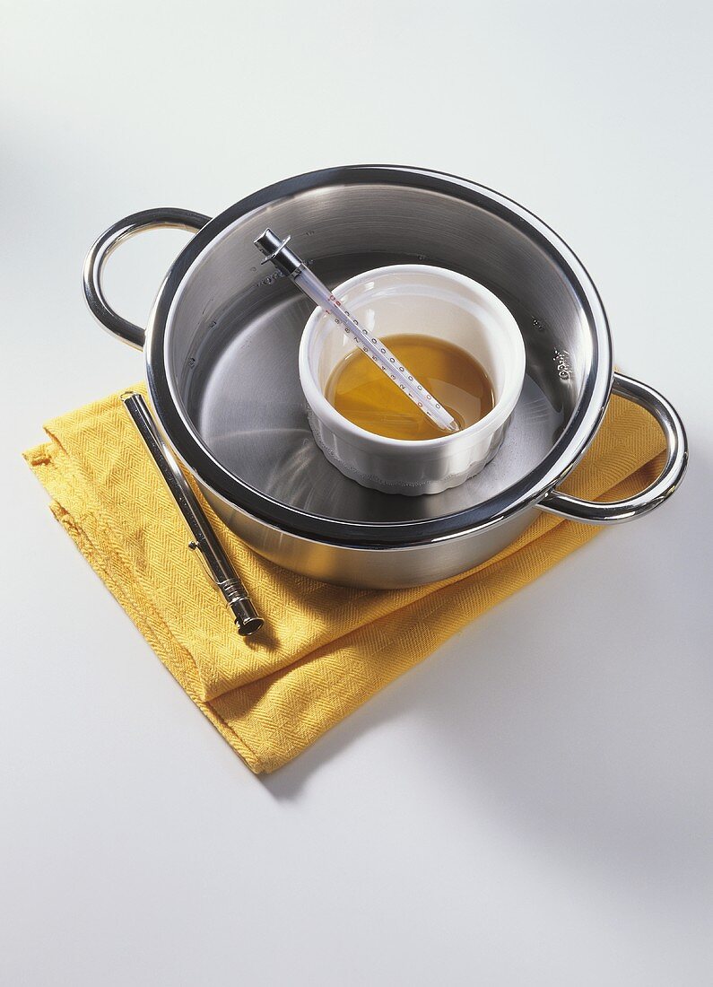 Warming almond oil in bain-marie (for massage)