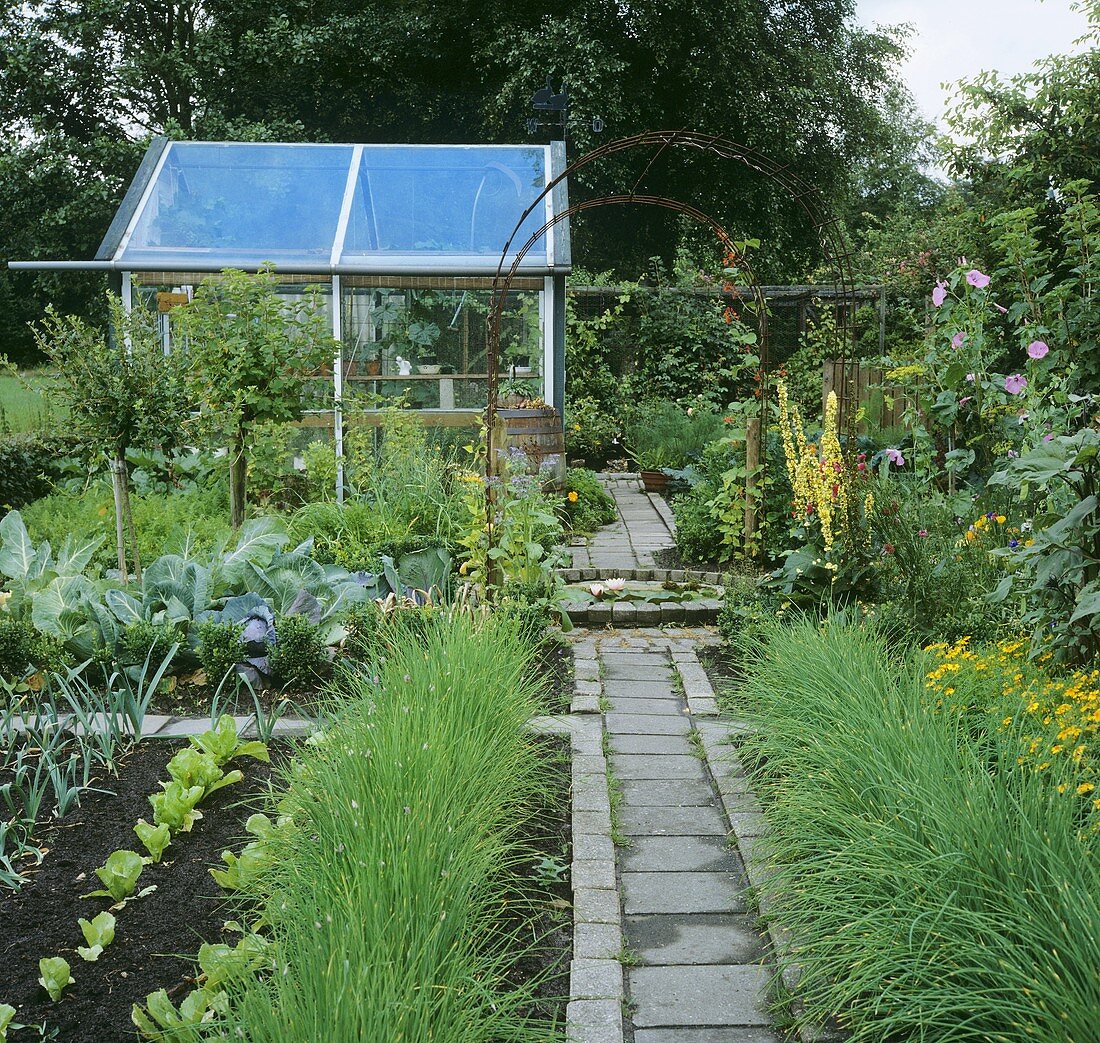 Kitchen garden and flower garden with greenhouse