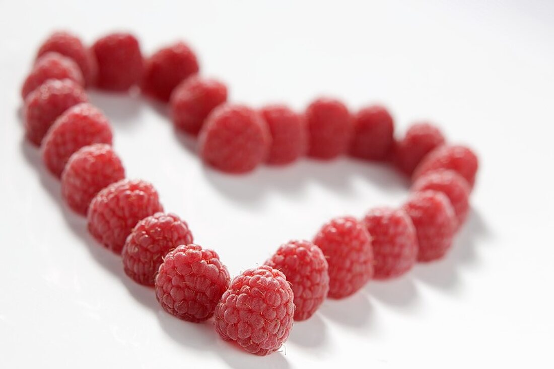 Fresh raspberries forming a heart