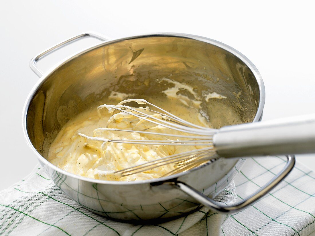Making Bavarian cream: whisking custard and cream