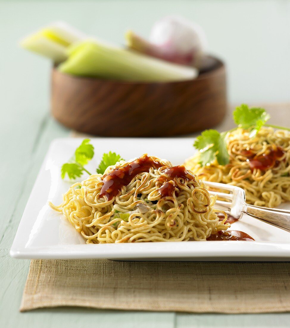 Asian noodle nests with chicken and orange ginger sauce