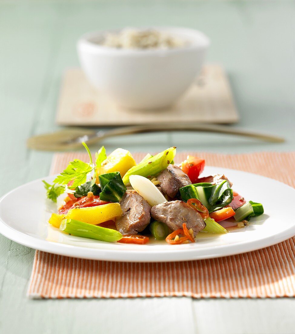 Stir-fried strips of duck with vegetables and pineapple